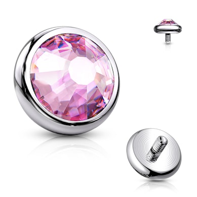 Titaanist dermal anchor kivikesega.