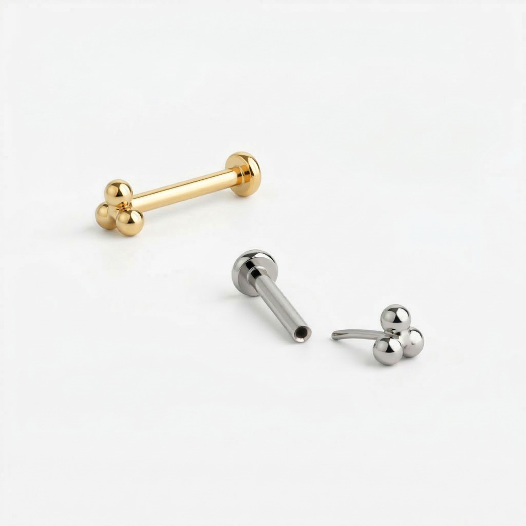 Titaanist push-in labret kolmnurkse kuulikobaraga pealsega